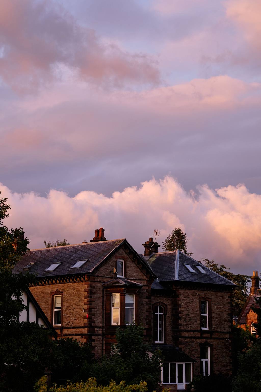 Row of red-brick houses at dusk